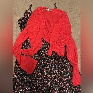 cute floral black slim fit dress with small complimentary red sweater